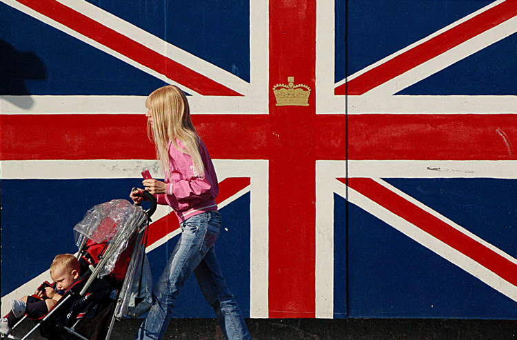 British flag (Union Jack), young girl and a kid in a pram
